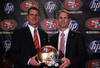 SAN FRANCISCO, CA - JANUARY 07:  Jim Harbaugh and general manager Trent Baalke pose for a picture following a press conference where Harbaugh was introduced as the new San Francisco 49ers head coach at the Palace Hotel on January 7, 2011 in San Francisco, California.  (Photo by Ezra Shaw/Getty Images)