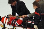 CHICAGO, IL - APRIL 17:  Marian Hossa #81 of the Chicago Blackhawks is moved off of the ice on a stretcher following a collison with Raffi Torres of the Phoenix Coyotes in Game Three of the Western Conference Quarterfinals during the 2012 NHL Stanley Cup Playoffs at the United Center on April 17, 2012 in Chicago, Illinois. The Coyotes defeated the Blackhawks 3-2 in overtime.  (Photo by Jonathan Daniel/Getty Images)