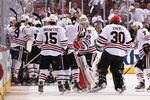 GLENDALE, AZ - APRIL 21:  The Chicago Blackhawks celebrate after Jonathan Toews scored the game winning goal against the Phoenix Coyotes in overtime of Game Five of the Western Conference Quarterfinals during the 2012 NHL Stanley Cup Playoffs at Jobing.com Arena on April 21, 2012 in Glendale, Arizona. The Blackhawks defeated the Coyotes 2-1 in overtime. (Photo by Christian Petersen/Getty Images)