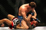 ATLANTA, GA - APRIL 21:  Rory MacDonald (top) punches Che Mills during their welterweight bout for UFC 145 at Philips Arena on April 21, 2012 in Atlanta, Georgia.  (Photo by Kevin C. Cox/Getty Images)