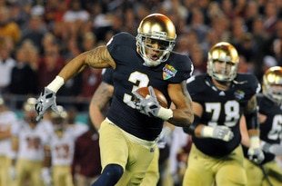ORLANDO, FL - DECEMBER 29: Wide receiver Michael Floyd #3 of the Notre Dame Fight Irish runs upfield against the Florida State Seminoles in the Champs Sports Bowl December 29, 2011 at the Florida Citrus Bowl in Orlando, Florida.  FSU won 18 - 14. (Photo by Al Messerschmidt/Getty Images)