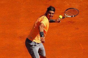 MONTE-CARLO, MONACO - APRIL 22:    Rafael Nadal of Spain shows his delight as he hits a ball into the crowd after his straight sets victory against Novak Djokovic of Serbia in the final  during day eight of the ATP Monte Carlo Masters, at Monte-Carlo Sporting Club on April 22, 2012 in Monte-Carlo, Monaco..  (Photo by Clive Brunskill/Getty Images)