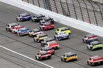 KANSAS CITY, KS - APRIL 22:  Martin Truex Jr., driver of the #56 NAPA Auto Parts Toyota, leads the field during the NASCAR Sprint Cup Series STP 400 at Kansas Speedway on April 22, 2012 in Kansas City, Kansas.  (Photo by Jerry Markland/Getty Images for NASCAR)
