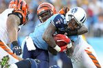 NASHVILLE, TN - NOVEMBER 06:  Chris Johnson #28 of the Tennessee Titans runs with the ball and is tackled by Brandon Johnson #59 of the Cincinnati Bengals during the NFL game at LP Field on November 6, 2011 in Nashville, Tennessee.  (Photo by Andy Lyons/Getty Images)