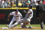 SEATTLE, WA - APRIL 22:  Alex Rios #51 of the Chicago White Sox slides into second on a double against shortstop Brendan Ryan #26 of the Seattle Mariners at Safeco Field on April 22, 2012 in Seattle, Washington. The White Sox defeated the Mariners 7-4. (Photo by Otto Greule Jr/Getty Images)