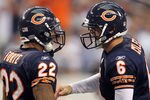 ARLINGTON, TX - SEPTEMBER 19:  (L-R) Running back Matt Forte #22 and Jay Cutler #6 of the Chicago Bears celebrate a touchdown against the Dallas Cowboys in the fourth quarter at Cowboys Stadium on September 19, 2010 in Arlington, Texas.  (Photo by Ronald Martinez/Getty Images)