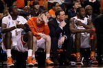 BOSTON, MA - MARCH 24:  Baye Keita #12, Trevor Cooney #10, Gerry McNamara and Dion Waiters #3 of the Syracuse Orange look on from the bench towards the end of their game against the Ohio State Buckeyes during the 2012 NCAA Men's Basketball East Regional Final at TD Garden on March 24, 2012 in Boston, Massachusetts.  (Photo by Elsa/Getty Images)