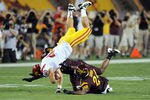 TEMPE, AZ - SEPTEMBER 24:  Rhett Ellison #40 of the University of Southern California Trojans gets up ended after making a catch by Osahon Irabor #24 of the Arizona State Sun Devils at Sun Devil Stadium on September 24, 2011 in Tempe, Arizona.  (Photo by Norm Hall/Getty Images)