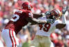 NORMAN, OK - SEPTEMBER 11:  Offensive lineman Donald Stephenson #59 of the Oklahoma Sooners grabs the facemask of Brandon Jenkins #49 of the Florida State Seminoles at Gaylord Family Oklahoma Memorial Stadium on September 11, 2010 in Norman, Oklahoma.  (Photo by Ronald Martinez/Getty Images)