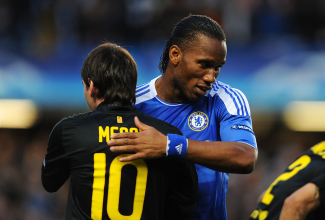 LONDON, ENGLAND - APRIL 18:  Didier Drogba of Chelsea hugs Lionel Messi of Barcelona during the UEFA Champions League Semi Final first leg match between Chelsea and Barcelona at Stamford Bridge on April 18, 2012 in London, England.  (Photo by Michael Regan/Getty Images)