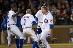 CHICAGO, IL - APRIL 23:   Alfonso Soriano #12 and Tony Campana #1 of the Chicago Cubs run out onto the field to celebrate with teammate Joe Mather #16 after he hit a game-winning RBI single scoring Geovany Soto #18 and Bryan LaHair #6 during the ninth inning against the St. Louis Cardinals at Wrigley Field on April 23, 2012 in Chicago, Illinois. The Cubs defeated the Cardinals 3-2.  (Photo by Brian Kersey/Getty Images)