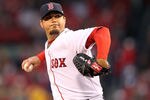 BOSTON, MA - APRIL 18:  Josh Beckett #19 of the Boston Red Sox throws against the Texas Rangers at Fenway Park April 18, 2012  in Boston, Massachusetts. (Photo by Jim Rogash/Getty Images)
