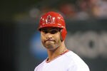 ANAHEIM, CA - APRIL 21:  Albert Pujols #5 of the Los Angeles Angels of Anaheim stands on first base after a walk in the fifth inning against the Baltimore Orioles at Angel Stadium of Anaheim on April 21, 2012 in Anaheim, California.  (Photo by Lisa Blumenfeld/Getty Images)