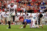 JACKSONVILLE, FL - OCTOBER 29:  Richard Samuel #22 of the Georgia Bulldogs runs for yardage past Josh Evans #24 of the Florida Gators during the game at EverBank Field on October 29, 2011 in Jacksonville, Florida.  (Photo by Sam Greenwood/Getty Images)