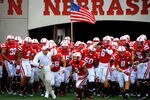 LINCOLN, NE - SEPTEMBER 3: Head Coach Bo Pelini leads his Nebraska Cornhuskers onto the field against the Chattanooga Mocs before their game at Memorial Stadium September 3, 2011 in Lincoln, Nebraska. Nebraska won 40-7. (Photo by Eric Francis/Getty Images)