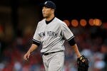 ARLINGTON, TX - APRIL 24:  Hiroki Kuroda #18 of the New York Yankees walks to the dugout against the Texas Rangers in the first inning at Rangers Ballpark in Arlington on April 24, 2012 in Arlington, Texas.  (Photo by Ronald Martinez/Getty Images)