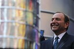 NEW YORK, NY - APRIL 11:  NHL Commissioner Gary Bettman stands next to the Stanley Cup trophy in Times Square on April 11, 2012 in New York City.  To kick off the start of the NHL Stanley Cup playoffs, a 21 foot, 6,600 pound replica of the Stanley Cup trophy was unveiled in Times Square. The replica trophy doubles as a water fountain that New York residents and visitors can drink from.  (Photo by Justin Sullivan/Getty Images)