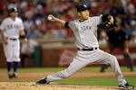 ARLINGTON, TX - APRIL 24:  Hiroki Kuroda #18 of the New York Yankees throws against the Texas Rangers in the first inning at Rangers Ballpark in Arlington on April 24, 2012 in Arlington, Texas.  (Photo by Ronald Martinez/Getty Images)