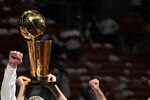 MIAMI, FL - JUNE 12:  Jason Kidd #2 of the Dallas Mavericks holds up the Larry O'Brien Championship trophy as he celebrates with his teammates and team owner Mark Cuban after they won 105-95 against the Miami Heat in Game Six of the 2011 NBA Finals at American Airlines Arena on June 12, 2011 in Miami, Florida. NOTE TO USER: User expressly acknowledges and agrees that, by downloading and/or using this Photograph, user is consenting to the terms and conditions of the Getty Images License Agreement.  (Photo by Ronald Martinez/Getty Images)
