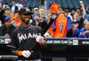 NEW YORK, NY - APRIL 24:  Jose Reyes #7 of the Miami Marlins looks at a tribute video of himself when he played for the New York Mets before his first game back to Citi Field against the Mets on April 24, 2012 at Citi Field in the Flushing neighborhood of the Queens borough of New York City.  (Photo by Al Bello/Getty Images)