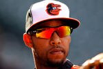 BALTIMORE, MD - APRIL 09: Robert Andino #11 of the Baltimore Orioles warms up before the start of the Orioles game against the New York Yankees at Oriole Park at Camden Yards on April 9, 2012 in Baltimore, Maryland.  (Photo by Rob Carr/Getty Images)