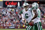 LANDOVER, MD - DECEMBER 04:  Mark Sanchez #6 of the New York Jets celebrates after throwing a touchdown pass to Santonio Holmes #10 during the second half against the Washington Redskins at FedExField on December 4, 2011 in Landover, Maryland.  (Photo by Rob Carr/Getty Images)