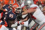CHAMPAIGN, IL - OCTOBER 15: Whitney Mercilus #85 of the Illinois Fighting Illini rushes against Jack Mewhort #74 of the Ohio State Buckeyes at Memorial Stadium on October 15, 2011 in Champaign, Illinois. Ohio State defeated Illinois 17-7. (Photo by Jonathan Daniel/Getty Images)