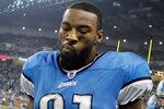 DETROIT, MI - NOVEMBER 24:  Calvin Johnson #81 and  Matthew Stafford #9 of the Detroit Lions leave the field after scoring a fourth quarter touchdown but still losing the game 1-28 to the Green Bay Packers at Ford Field on November 24, 2011 in Detroit, Michigan.  Green Bay won the game 27-15. (Photo by Gregory Shamus/Getty Images)