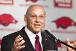 FAYETTEVILLE, AR - APRIL 24:   New Head Coach John L. Smith of the Arkansas Razorbacks speaks to the media at the press conference to announce him as new Head Coach in the Raymond Miller Room on April 24, 2012 in Fayetteville, Arkansas.  (Photo by Wesley Hitt/Getty Images)
