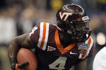 NEW ORLEANS, LA - JANUARY 03:  David Wilson #4 of the Virginia Tech Hokies runs the ball against the Michigan Wolverines during the Allstate Sugar Bowl at Mercedes-Benz Superdome on January 3, 2012 in New Orleans, Louisiana.  (Photo by Matthew Stockman/Getty Images)