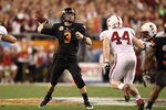 GLENDALE, AZ - JANUARY 02:  Brandon Weeden #3 of the Oklahoma State Cowboys throws a pass during the Tostitos Fiesta Bowl against the Stanford Cardinal on January 2, 2012 at University of Phoenix Stadium in Glendale, Arizona.  (Photo by Christian Petersen/Getty Images)