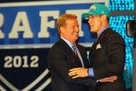 NEW YORK, NY - APRIL 26:  Ryan Tannehill from Texas A&M holds greets NFL Commissioner Roger Goodell after he was selected #8 overall by the Miami Dolphins in the first round of during the 2012 NFL Draft at Radio City Music Hall on April 26, 2012 in New York City.  (Photo by Al Bello/Getty Images)