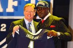 NEW YORK, NY - APRIL 26:  Melvin Ingram of South Carolina holds up a jersey as he stands on stage with NFL Commissioner Roger Goodell after he was selected #18 overall by the San Diego Chargers in the first round of the 2012 NFL Draft at Radio City Music Hall on April 26, 2012 in New York City.  (Photo by Al Bello/Getty Images)