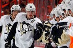 PHILADELPHIA, PA - APRIL 22:  Evgeni Malkin #71 of the Pittsburgh Penguins is congratulated by teammates after scoring a goal against the Philadelphia Flyers in Game Six of the Eastern Conference Quarterfinals during the 2012 NHL Stanley Cup Playoffs at Wells Fargo Center on April 22, 2012 in Philadelphia, Pennsylvania. The Flyers won the game 5-1 to eliminate the Penguins from the playoffs.  (Photo by Paul Bereswill/Getty Images)