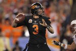 GLENDALE, AZ - JANUARY 02:  Brandon Weeden #3 of the Oklahoma State Cowboys throws a pass against the Stanford Cardinal  during the Tostitos Fiesta Bowl on January 2, 2012 at University of Phoenix Stadium in Glendale, Arizona. Oklahoma State won 41-38 in overtime.  (Photo by Doug Pensinger/Getty Images)