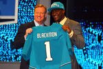 NEW YORK, NY - APRIL 26:  Justin Blackmon (R) from Oklahoma State holds up a jersey as he stands on stage with NFL Commissioner Roger Goodell after he was selected #5 overall by the Jacksonville Jaguars in the first round of the 2012 NFL Draft at Radio City Music Hall on April 26, 2012 in New York City.  (Photo by Al Bello/Getty Images)