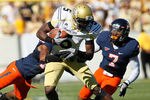 ATLANTA - OCTOBER 09:  Stephen Hill #5 of the Georgia Tech Yellow Jackets is tackled by Chase Minnifield #13 and Corey Mosley #7 of the Virginia Cavaliers at Bobby Dodd Stadium on October 9, 2010 in Atlanta, Georgia.  (Photo by Kevin C. Cox/Getty Images)