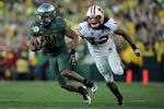 PASADENA, CA - JANUARY 02:  Running back LaMichael James #21 of the Oregon Ducks runs the ball against the Wisconsin Badgers at the 98th Rose Bowl Game on January 2, 2012 in Pasadena, California.  (Photo by Harry How/Getty Images)