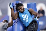 INDIANAPOLIS, IN - FEBRUARY 27: Linebacker Courtney Upshaw of Alabama takes part in a drill during the 2012 NFL Combine at Lucas Oil Stadium on February 27, 2012 in Indianapolis, Indiana. (Photo by Joe Robbins/Getty Images)