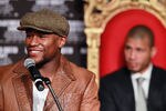 HOLLYWOOD, CA - MARCH 01:  Floyd Mayweather smiles during a press conference to promote his upcoming fight against Miguel Cotto on May 5 at the MGM Grand in Las Vegas at Grauman's Chinese Theatre on March 1, 2012 in Hollywood, California.  (Photo by Jeff Gross/Getty Images)