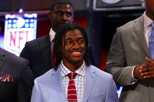 NEW YORK, NY - APRIL 26:  Robert Griffin III from Baylor smiles on stage during the first round of the 2012 NFL Draft at Radio City Music Hall on April 26, 2012 in New York City. Griffin III was selected #2 overall by the Washington Redskins.  (Photo by Al Bello/Getty Images)