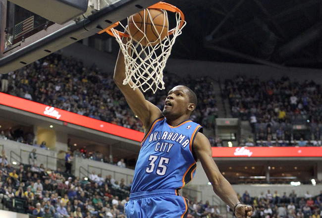 INDIANAPOLIS, IN - APRIL 06:  Kevin Durant #35 of the Oklahoma City Thunder dunks the ball during the NBA game against the Indiana Pacers at Bankers Life Fieldhouse on April 6, 2012 in Indianapolis, Indiana.  NOTE TO USER: User expressly acknowledges and agrees that, by downloading and or using this photograph, User is consenting to the terms and conditions of the Getty Images License Agreement.  (Photo by Andy Lyons/Getty Images)