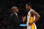 LOS ANGELES - DECEMBER 25:  Head coach Mike Brown talks with Devin Ebanks #3 of the Los Angeles Lakers during the game against the Chicago Bulls at Staples Center on December 25, 2011 in Los Angeles, California.  NOTE TO USER: User expressly acknowledges and agrees that, by downloading and or using this photograph, User is consenting to the terms and conditions of the Getty Images License Agreement.  (Photo by Lisa Blumenfeld/Getty Images)
