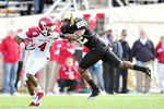 NASHVILLE, TN - OCTOBER 29:  Eric Samuels #22 of the Vanderbilt Commodores draws a facemask penalty as he tackles Jarius Wright #4 of the Arkansas Razorbacks during play at Vanderbilt Stadium on October 29, 2011 in Nashville, Tennessee. Arkansas won 31-28.  (Photo by Grant Halverson/Getty Images)