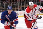 NEW YORK, NY - APRIL 07:  Ryan McDonagh #27 of the New York Rangers skates with the puck in front of Alex Ovechkin #8 of the Washington Capitals at Madison Square Garden on April 7, 2012 in New York City.  (Photo by Nick Laham/Getty Images)