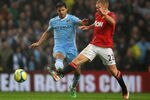 MANCHESTER, ENGLAND - JANUARY 08:  Paul Scholes of Manchester United competes with Sergio Aguero of Manchester City during the FA Cup Third Round match between Manchester City and Manchester United at the Etihad Stadium on January 8, 2012 in Manchester, England.  (Photo by Alex Livesey/Getty Images)
