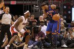 MIAMI, FL - FEBRUARY 27:  Carmelo Anthony #7 of the New York Knicks is guarded by LeBron James #6 of the Miami Heat during a game at American Airlines Arena on February 27, 2011 in Miami, Florida. NOTE TO USER: User expressly acknowledges and agrees that, by downloading and/or using this Photograph, User is consenting to the terms and conditions of the Getty Images License Agreement.  (Photo by Mike Ehrmann/Getty Images)