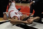 CHICAGO, IL - APRIL 28:  Derrick Rose #1 of the Chicago Bulls is examined after suffering an injury against the Philadelphia 76ers in Game One of the Eastern Conference Quarterfinals during the 2012 NBA Playoffs at the United Center on April 28, 2012 in Chicago, Illinois. The Bulls defeated the 76ers 103-91. NOTE TO USER: User expressly acknowledges and agrees that, by downloading and or using this photograph, User is consenting to the terms and conditions of the Getty Images License Agreement.  (Photo by Jonathan Daniel/Getty Images)