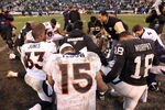 OAKLAND, CA - DECEMBER 19:  Tim Tebow #15 of the Denver Broncos prayers with a group of players after their game against the Oakland Raiders at Oakland-Alameda County Coliseum on December 19, 2010 in Oakland, California.  (Photo by Ezra Shaw/Getty Images)
