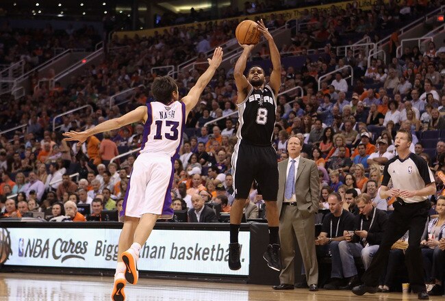PHOENIX, AZ - APRIL 25:  Patty Mills #8 of the San Antonio Spurs puts up a shot over Steve Nash #13 of the Phoenix Suns during the NBA game at US Airways Center on April 25, 2012 in Phoenix, Arizona.  NOTE TO USER: User expressly acknowledges and agrees that, by downloading and or using this photograph, User is consenting to the terms and conditions of the Getty Images License Agreement.  (Photo by Christian Petersen/Getty Images)